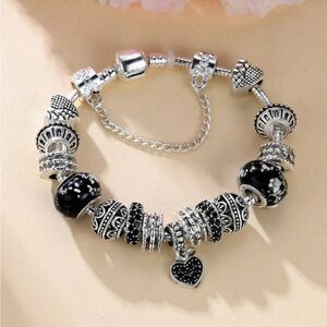 Elegant Black and Silver Puzzle & Heart Charm Bracelet